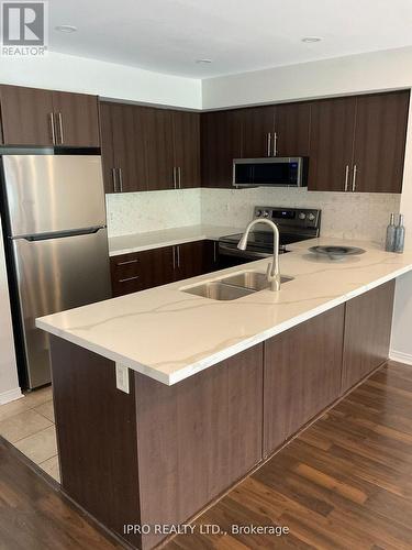 8 - 3070 Thomas Street, Mississauga, ON - Indoor Photo Showing Kitchen With Double Sink