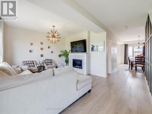 22 - 3380 Singleton Avenue, London, ON - Indoor Photo Showing Living Room With Fireplace