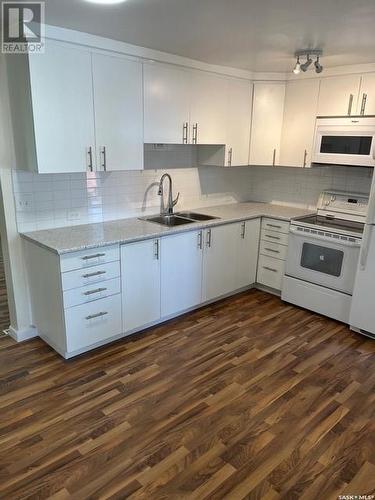 652 102Nd Street, North Battleford, SK - Indoor Photo Showing Kitchen With Double Sink