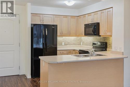 101 - 400 William Graham Drive, Aurora, ON - Indoor Photo Showing Kitchen With Double Sink