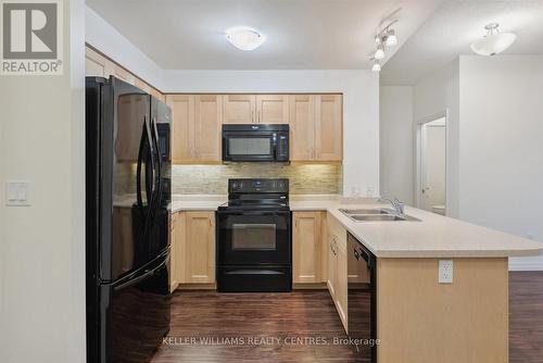 101 - 400 William Graham Drive, Aurora, ON - Indoor Photo Showing Kitchen With Double Sink