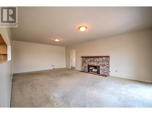 8109 Kalview Drive, Vernon, BC - Indoor Photo Showing Living Room With Fireplace