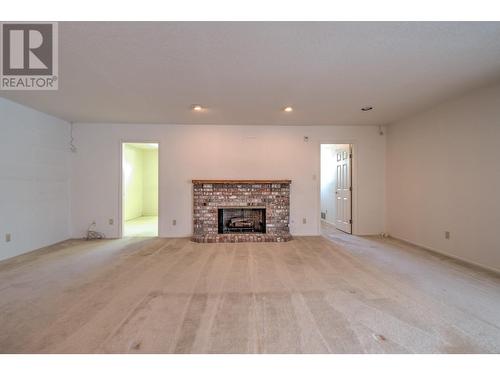 8109 Kalview Drive, Vernon, BC - Indoor Photo Showing Living Room With Fireplace