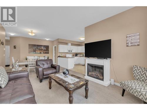 778 Rutland Road Unit# 402, Kelowna, BC - Indoor Photo Showing Living Room With Fireplace