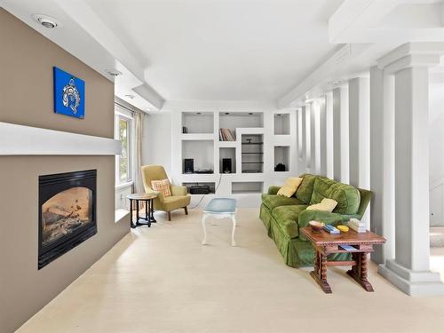 909 Mcmillan Avenue, Winnipeg, MB - Indoor Photo Showing Living Room With Fireplace