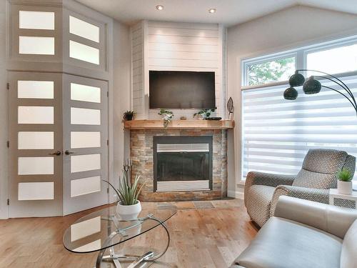 Salon - 31 111E Avenue O., Blainville, QC - Indoor Photo Showing Living Room With Fireplace