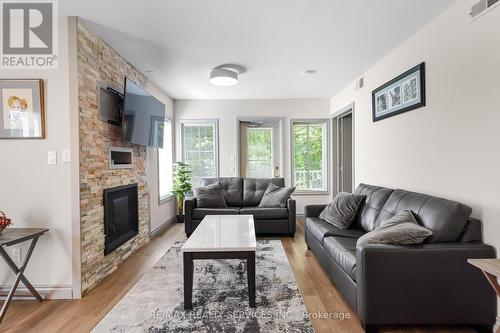 2069 - 90 Highland Drive, Oro-Medonte (Shanty Bay), ON - Indoor Photo Showing Living Room With Fireplace