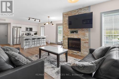 2069 - 90 Highland Drive, Oro-Medonte (Shanty Bay), ON - Indoor Photo Showing Living Room With Fireplace