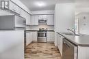 101 - 128 Barrie Street, Bradford West Gwillimbury, ON  - Indoor Photo Showing Kitchen With Double Sink 