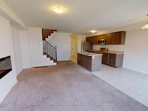 14 Longboat Run  W, Brantford, ON - Indoor Photo Showing Kitchen With Fireplace