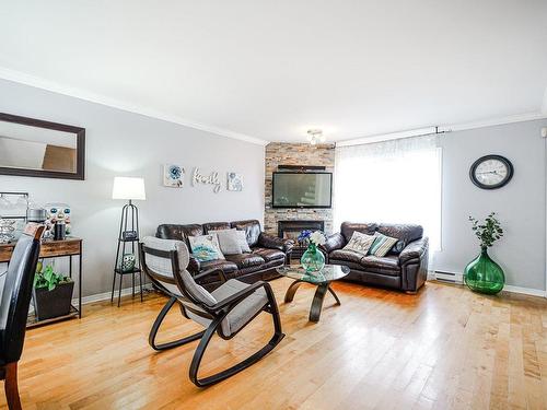 Salon - 14 Rue De L'Amandier, Saint-Constant, QC - Indoor Photo Showing Living Room With Fireplace