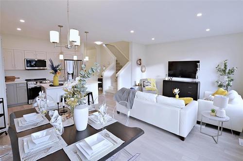 34 Saddle Creek Cove, Winnipeg, MB - Indoor Photo Showing Living Room With Fireplace