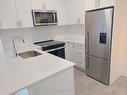 1306-3220 William Coltson Ave, Oakville, ON  - Indoor Photo Showing Kitchen With Stainless Steel Kitchen 