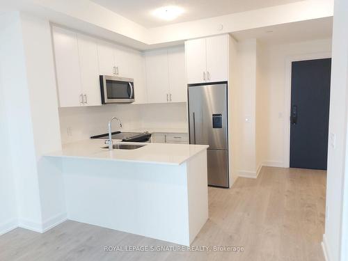 1306-3220 William Coltson Ave, Oakville, ON - Indoor Photo Showing Kitchen With Stainless Steel Kitchen