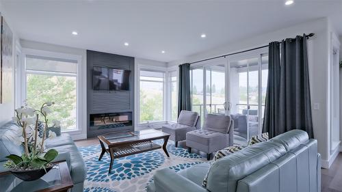 1110 Goldfinch Place, Kelowna, BC - Indoor Photo Showing Living Room With Fireplace