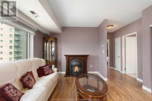 5064 Wyandotte Street East Unit# 606, Windsor, ON - Indoor Photo Showing Living Room With Fireplace