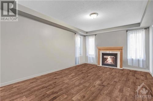 3560 River Run Avenue, Ottawa, ON - Indoor Photo Showing Living Room With Fireplace