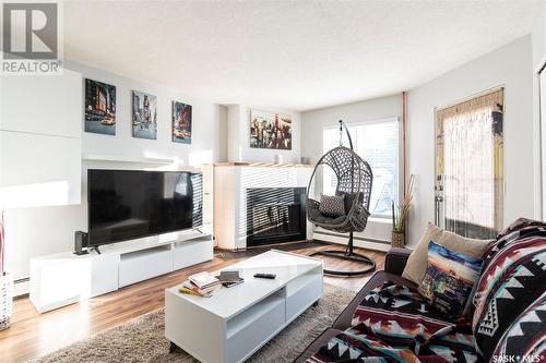 303 423 4Th Avenue N, Saskatoon, SK - Indoor Photo Showing Living Room With Fireplace