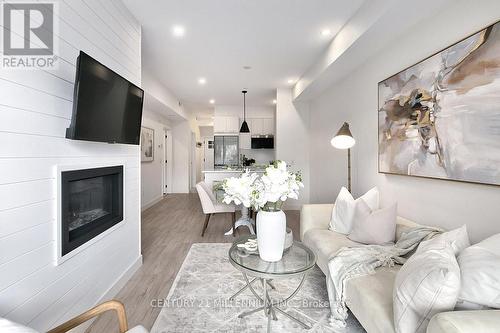 105 - 16 Beckwith Lane, Blue Mountains (Blue Mountain Resort Area), ON - Indoor Photo Showing Living Room With Fireplace