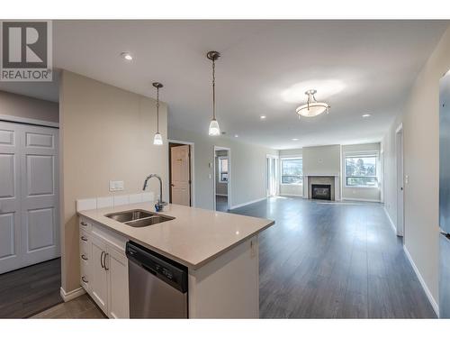 3388 Skaha Lake Road Unit# 606, Penticton, BC - Indoor Photo Showing Kitchen With Fireplace With Double Sink