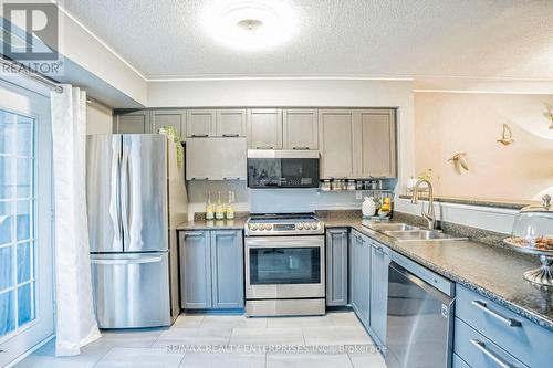 105 - 1487 Maple Avenue, Milton (Dempsey), ON - Indoor Photo Showing Kitchen With Stainless Steel Kitchen With Double Sink