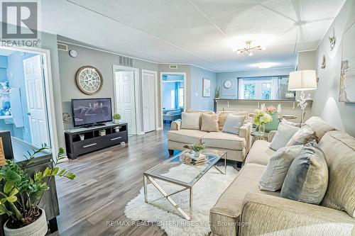 105 - 1487 Maple Avenue, Milton (Dempsey), ON - Indoor Photo Showing Living Room