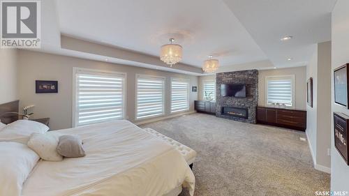 3878 Goldfinch Way, Regina, SK - Indoor Photo Showing Bedroom With Fireplace