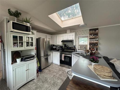 73 Baron Bay, Carberry, MB - Indoor Photo Showing Kitchen With Double Sink