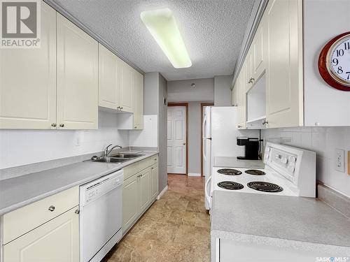 1004 717 Victoria Avenue, Saskatoon, SK - Indoor Photo Showing Kitchen With Double Sink