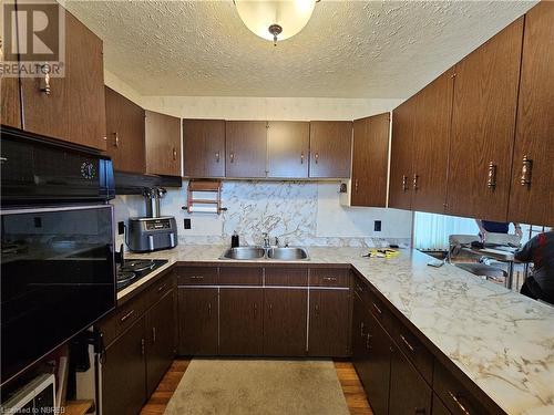 541 Brydges Street, Mattawa, ON - Indoor Photo Showing Kitchen With Double Sink