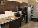 406 537 4Th Avenue N, Saskatoon, SK  - Indoor Photo Showing Kitchen With Double Sink 