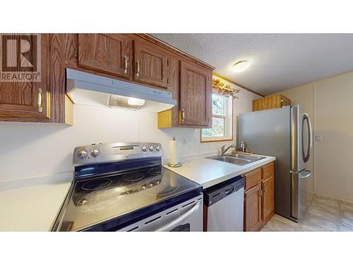 1975/1967 Jim Smith Lake  Road, Cranbrook, BC - Indoor Photo Showing Kitchen With Stainless Steel Kitchen With Double Sink