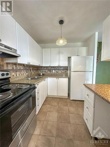 2020 Jasmine Crescent Unit#302, Ottawa, ON - Indoor Photo Showing Kitchen With Double Sink