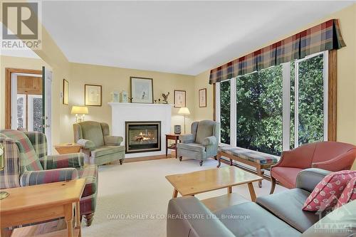 4537 Kingfish Bay Road N, Rideau Lakes, ON - Indoor Photo Showing Living Room With Fireplace