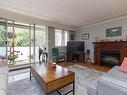 214-1025 Inverness Rd, Saanich, BC  - Indoor Photo Showing Living Room With Fireplace 