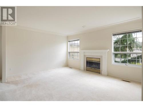 595 Yates Road Unit# 302, Kelowna, BC - Indoor Photo Showing Living Room With Fireplace