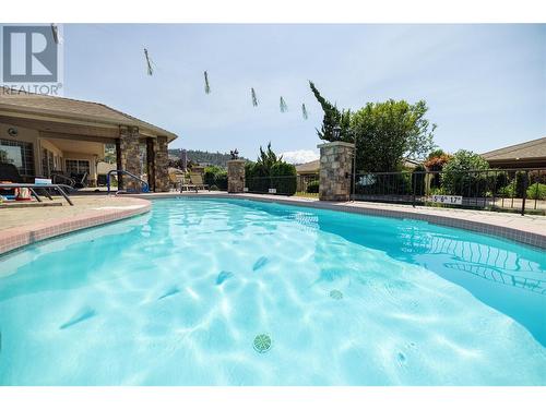 595 Yates Road Unit# 302, Kelowna, BC - Outdoor With In Ground Pool With Backyard