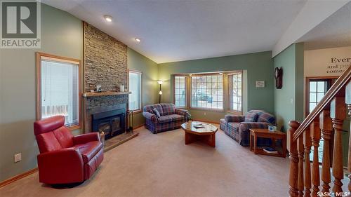 3318 Tanager Crescent E, Regina, SK - Indoor Photo Showing Living Room With Fireplace