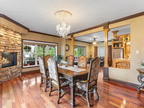 Dining room - 1065 Boul. Du Bord-De-L'Eau, Salaberry-De-Valleyfield, QC - Indoor Photo Showing Dining Room With Fireplace