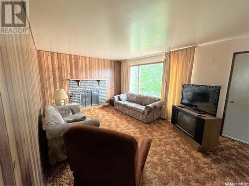 113 Prince Street, Hudson Bay, SK - Indoor Photo Showing Living Room With Fireplace