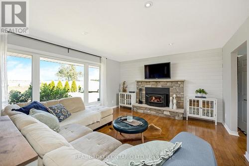 064232 County Rd 3, East Garafraxa, ON - Indoor Photo Showing Living Room With Fireplace