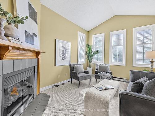 3 Heathcliffe Sq, Brampton, ON - Indoor Photo Showing Living Room With Fireplace