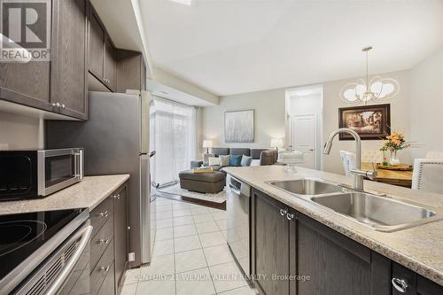 229 - 80 Aspen Springs Drive, Clarington (Bowmanville), ON - Indoor Photo Showing Kitchen With Double Sink