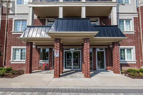 229 - 80 Aspen Springs Drive, Clarington (Bowmanville), ON - Outdoor With Balcony With Facade