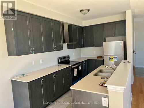 17 Bushwood Trail, Brampton, ON - Indoor Photo Showing Kitchen With Double Sink