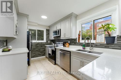 54 - 1290 Bridletowne Circle, Toronto (L'Amoreaux), ON - Indoor Photo Showing Kitchen With Double Sink