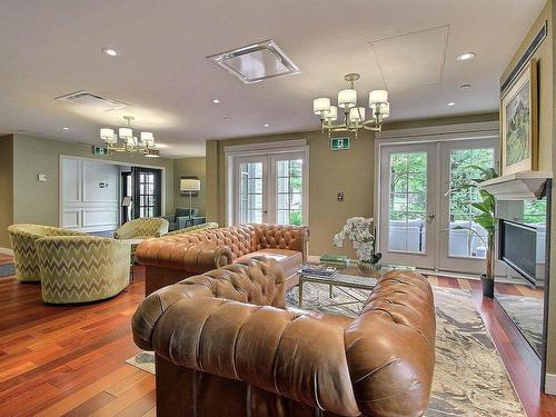 Hall d'entrÃ©e - 114-700 Ch. Ripple Cove, Ayer'S Cliff, QC - Indoor Photo Showing Living Room With Fireplace