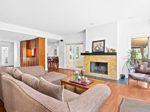 Living room - 42A Av. Du Golf, Pointe-Claire, QC - Indoor Photo Showing Living Room With Fireplace