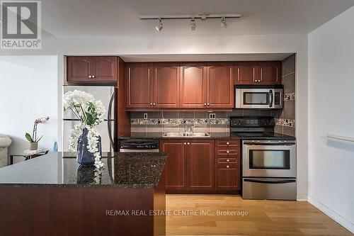 916 - 1040 The Queens Way, Toronto (Islington-City Centre West), ON - Indoor Photo Showing Kitchen With Double Sink