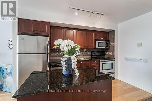 916 - 1040 The Queens Way, Toronto (Islington-City Centre West), ON - Indoor Photo Showing Kitchen With Stainless Steel Kitchen